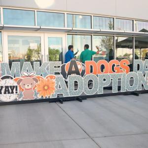 Sign: Make a dog's day yay! Adoption 2023