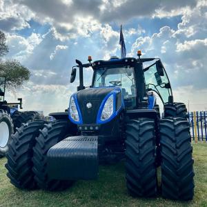 A blue tractor in a field