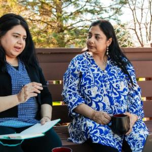 Syeda and her sister Darakhshan sat on a bench