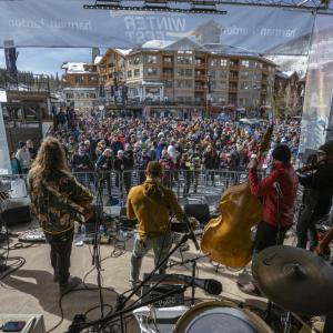 A band on a stage in front of a crowd
