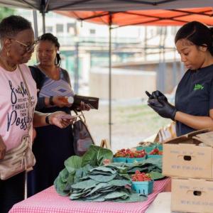 People buying fresh food