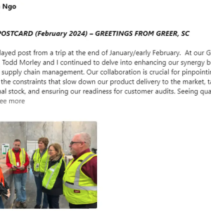 People in safety vests talking together