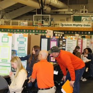 People sat at booths at the Salem County Science Fair
