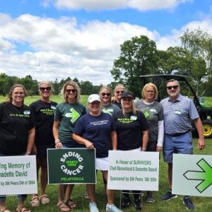 A group of people holding signs 