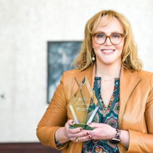 Person holding an award