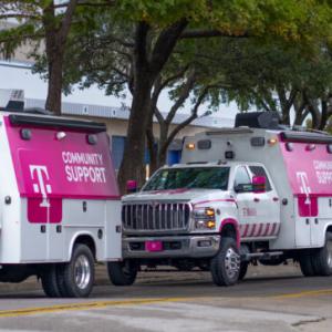 Three T-Mobile community support vehicles