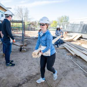 A person walking in a hardhat in a construction area