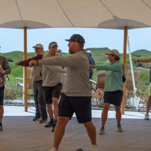 People doing exercises under a tent