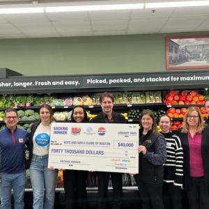 Group of people posing with check for $40,000