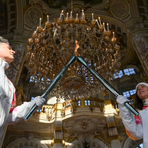 Two people lighting torches
