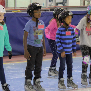 Youth skating indoors