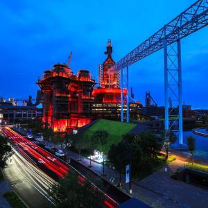Beijing at night with a building lit in red