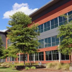 large building with trees in front