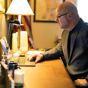 Andy Smith working on a laptop on a desk
