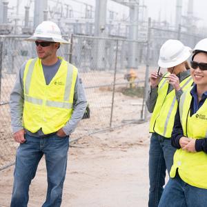 Wen Tong and two colleagues at a substation