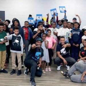 APP YOUniversity students smiling and holding up certificates