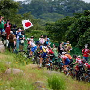 Bikers race up a hill