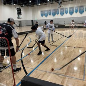 Students play ball hockey