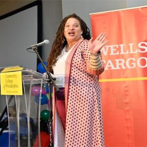 Women speaks at a podium