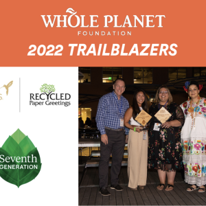 "Whole planet foundation 2022 Trailblazers" logos for Papyrus, recycled paper greetings, and seventh generation left of a photo of 5 people, two holding awards.