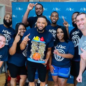 The winning team and top fundraisers — Aflac Employee Team:  Front row: Erica Cavanagh, Melissa Davis, Kendall Saxon, Veronica Goodwin, with Bob Ruff. Back row: Brandon Smalls, Quan Prowell, Refeno King, Jordan Vernon.