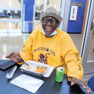 person eating and laughing