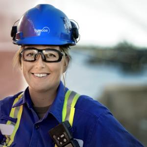 Person smiling while wearing work uniform