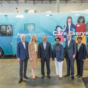 Truist and Atrium health leaders standing in front of Atrium Truck