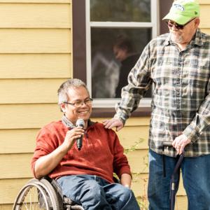 Homeowner with man in wheelchair