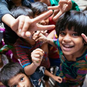 Children shown giving the V for victory sign.