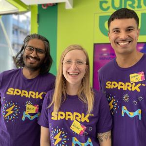 Three MilliporeSigma employees smile for photo.