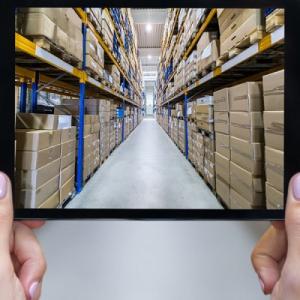 looking through a square at an aisle of boxes