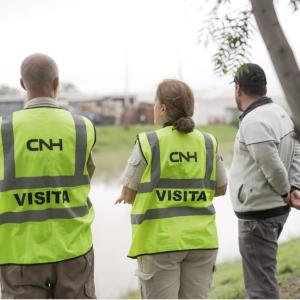 3 people meet out in the field 