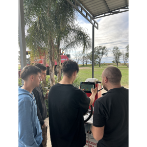 People looking at a piece of equipment together