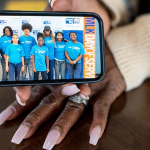 Benita Harrington sharing a photo on a mobile phone