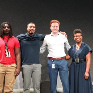 Four people stood together for a photo