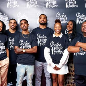 People standing together in Shake Your Future t-shirts