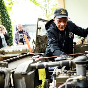 Someone looking at a vehicle engine 