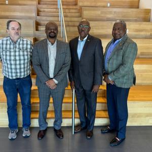 Four people stood together for a photo