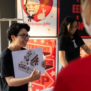 A person holding up a diagram 