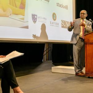 Person talking on stage