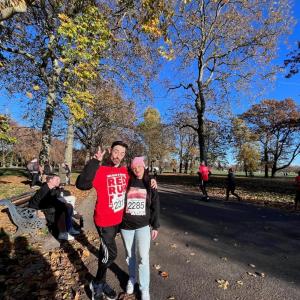 People standing together near a tree