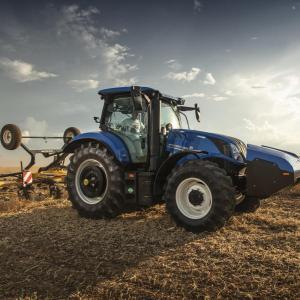 A blue tractor in a field