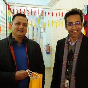 Two people stood together smiling 