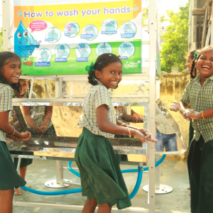 Kids in green uniforms laughing