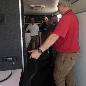 People talking together behind a table