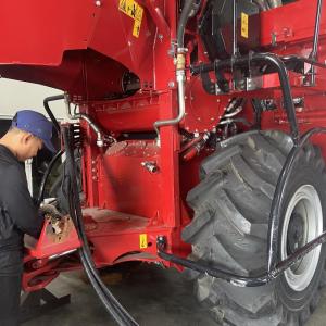 A person walking on agricultural machinery 