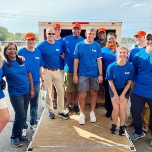A group of volunteers wearing blue t-shirts 