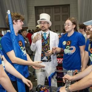People in blue t-shirts standing together