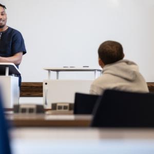 A person teaching a student